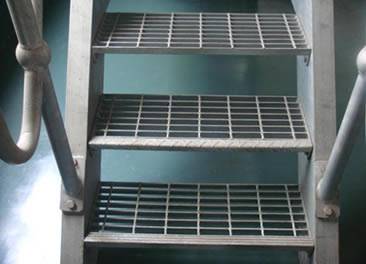Three stair treads are made of aluminum steel grating.