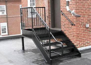 Carbon steel grating stair tread is installed out of the door.