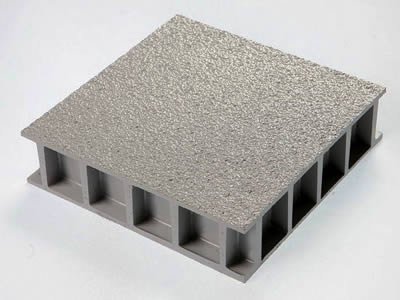 A covered FRP grating with gritted surface on the gray background.