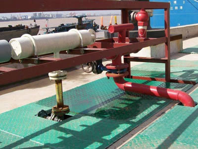 Green color covered FRP grating is installed around the pipe.