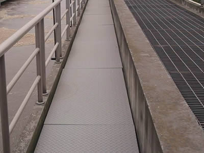 Gray color covered FRP gratings are installed on the street of pedestrian way.