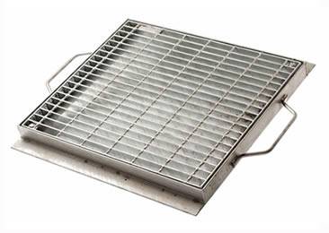 A drainage trench box grate with two handle on the frame.