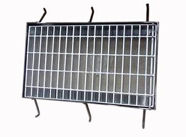 A galvanized drainage trench box grate with six supporting bars.