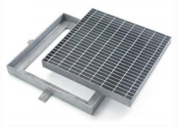 A welded steel grating is placed on the angle frame.