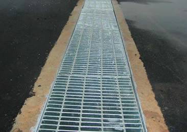 The angle frame is embed into the ground and the welded grates is covering the drainage.