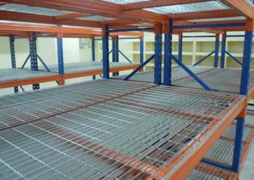 A temporary parking lot is made of platform grating and frames.
