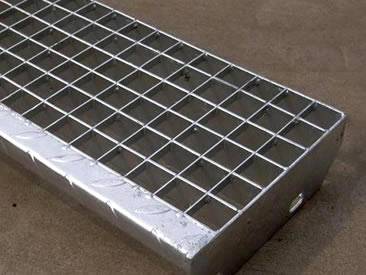 A piece of press-locked grating with a slice checker plate on it.