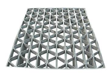 A riveted steel grating with serrated surface.