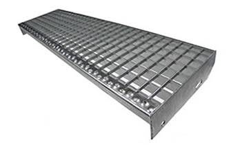 A swage-locked steel grating stair tread with round hole plate nosing.