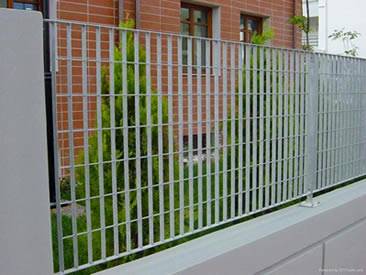 A wall of building is made of swage-locked grating.