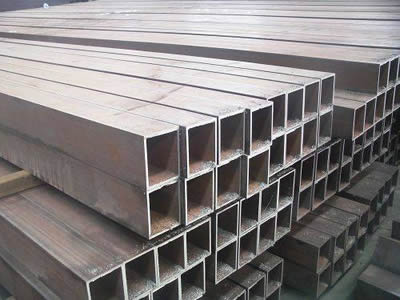 Several mild steel square tubes on the ground.