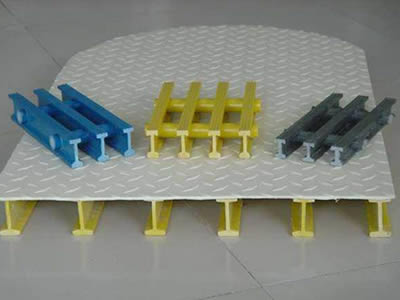 Covered FRP grating on the floor and three colors of pultruded grating on it.