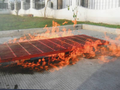 A piece of red color FRP grating in the burning fire.