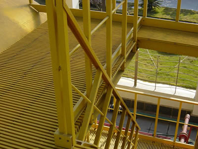 Yellow color FRP pultruded grating is covering the platform and stair treads.