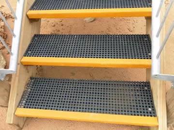 Three black color FRP gratings with yellow nosing are installed on the frames 