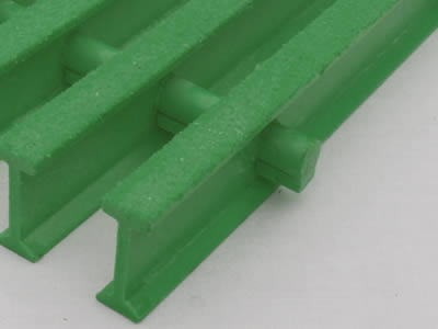 A piece of green color I bar FRP pultruded gratings on the gray background.