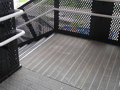Stair treads is consists of galvanized perforated grating and perforated metal mesh handrail infill.