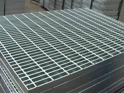 There are three pieces of steel gratings placed on the floor.