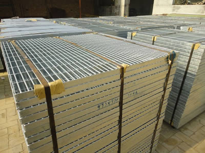 Several bundles of steel grating in the factory yard for waiting loading.