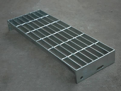 A bolted fixing steel grating on the ground.